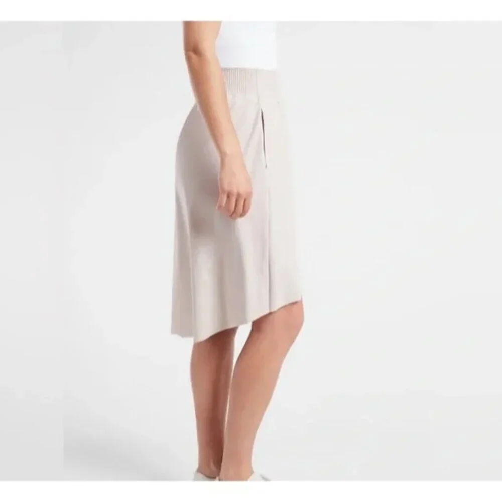 Athleta Cosmic Skirt Size Medium High-Low Hem Elastic Waist Zip Pockets Beige